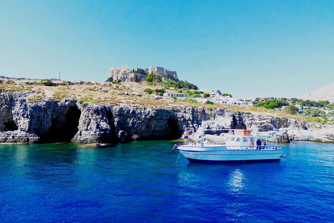 Lindos, Pefkos:Summer Breeze 3 Hour All Inclusive Swimming Cruise - Lindos Caves swim stop: rock-face snorkeling and cave entry time