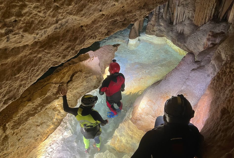 Mallorca: Aquatic Cave Exploration Guided Tour - The guided cave swim: helmets, headlamps, and real cave scale