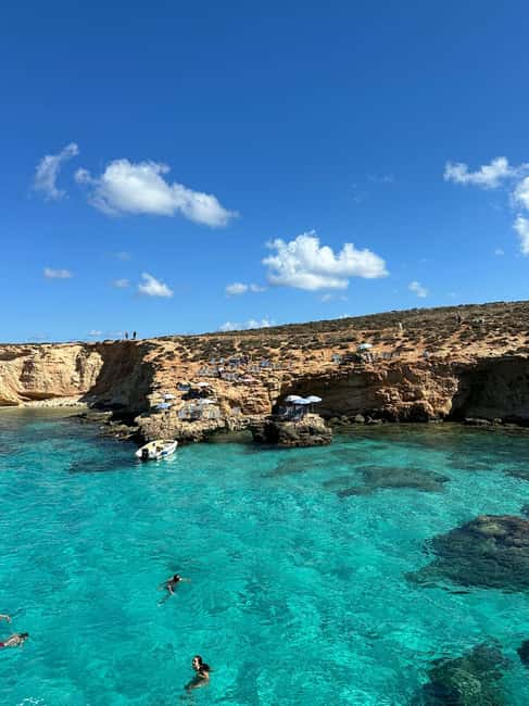 Malta: Gozo, Comino, Blue & Crystal Lagoon, & Caves Cruise - Comino time on the boat: Crystal Lagoon photo moments and deck-chair living