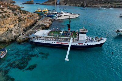 Malta Sunset Boat Tour: Bugibba to Comino Blue Lagoon Cruise - Cruising past St. Paul’s Island and the northern coves