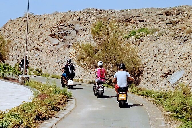 Maspalomas - Meloneras : e-Scooter 2 seat Sunset Guided Tour - The Campo Internacional cruising segment: palms, cacti, and viewpoint payoff