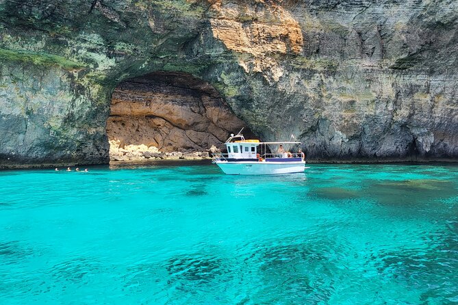 Mellieha: Gozo, Comino, Sea Caves, and Blue Lagoon Cruise - The boat setup: restroom, included boards, and small comforts