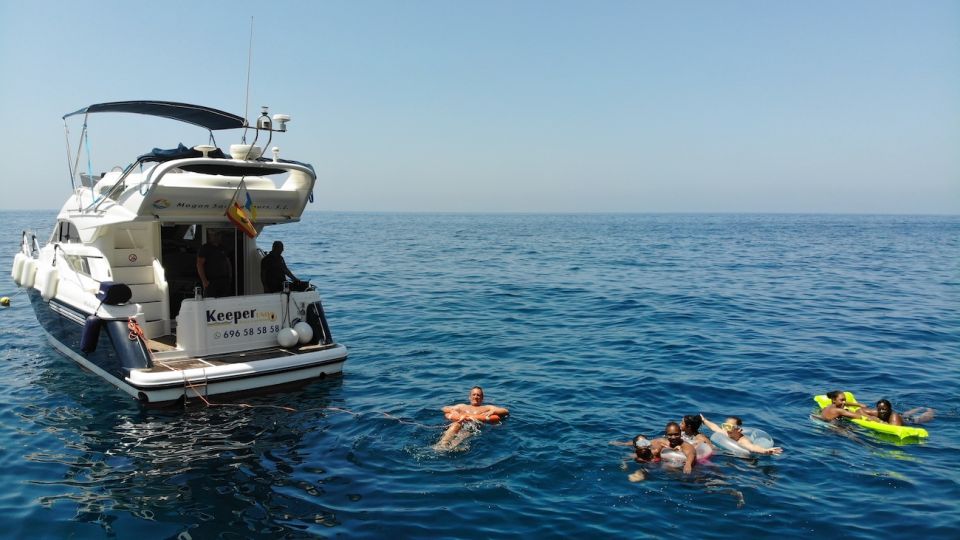 Mogan: Dolphin Watching Boat Trip with Swim Stop - The Snorkeling and Paddle Surfboard Stop: What It’s Like On Water