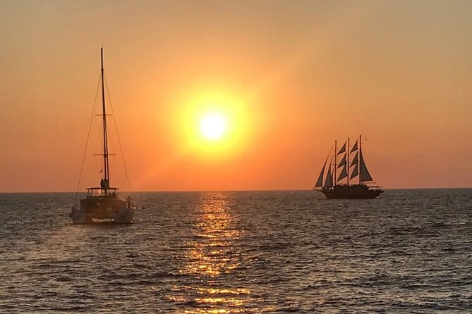 Morning and Sunset Cruise with Meal and Transport Included - Rhenia: the long swim stop with snorkeling gear and deckside comfort