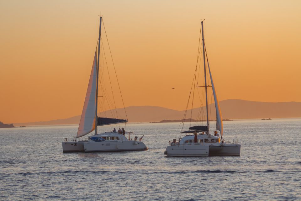 Mykonos: Catamaran Cruise with Lunch, Drinks and Transfer - Sailing Between Islands: Views, Windmills, and the Return Route