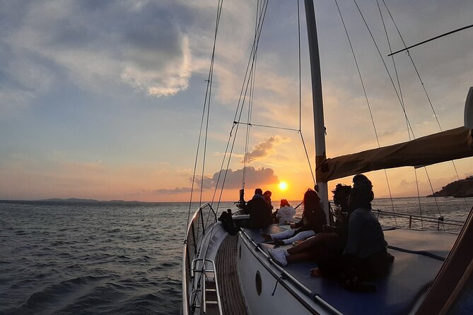 Mykonos Sunset Cruise with Drinks - The drinks and snacks: house wine, sodas, and a Greek-style bite