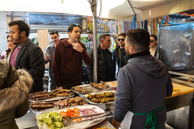 Palermo Street Food & Market Tour by Eating Europe - Piazza Ballaro grilled street food: sausage with fennel and mangia e bevi