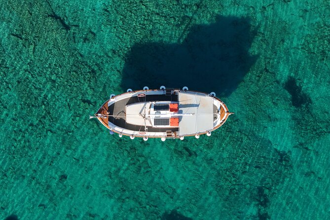 Paros Half Day Boat Tour from Naoussa port and Bay . - Boat comfort and group vibe: spacious enough, friendly crew, not crowded