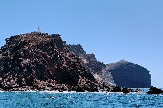 Private Full-Day Motor Yacht Cruise with Meal, Open Bar+Transfers - Red Beach and White Beach swims: short stops, big payoff