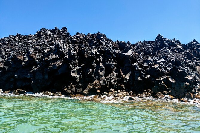 Private Full-Day Motor Yacht Cruise with Meal, Open Bar+Transfers - Thirasia snorkeling: short stop, real difference in the water