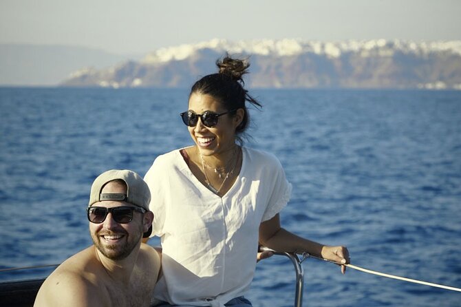 Private Luxury Santorini Catamaran Cruise with Port Pickup - Red Beach: volcanic red sand and a quick swim window