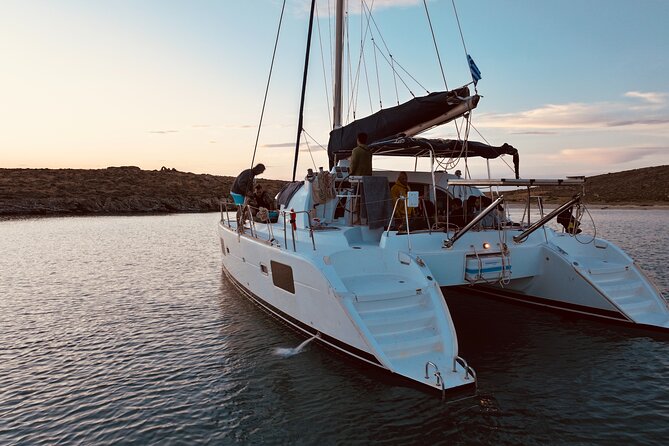 Private Mykonos Catamaran Day Cruise with Meals & Water Toys - Rineia Anchors: Snorkeling in Clearer Water Spots