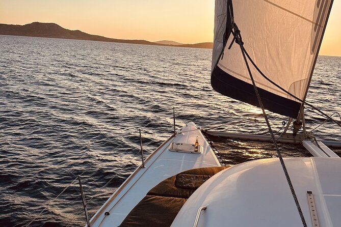 Private Mykonos Catamaran Day Cruise with Meals & Water Toys - Water Toys and Snorkeling Gear: Fun Between the Stops