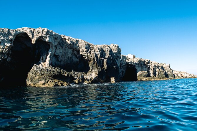 Private tour - Entering the sea caves: stalactites, coral-like shapes, and a true change of pace