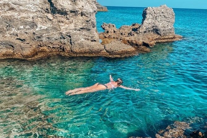 Rhodes Bay to Bay Swim Cruise-Greek Buffet w/wine included - Kallithea Springs Stop: Red Water, Free Sea Entrance, and Time to Swim