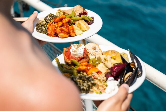 Rhodes Bay to Bay Swim Cruise-Greek Buffet w/wine included - Ladiko Bay and Afandou Beach: Oil-Trade Echoes, Caves, and a Big Lunch Window