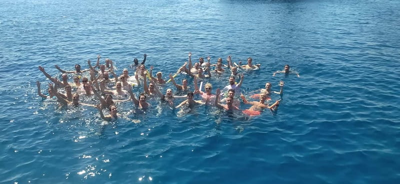 Rhodes: Pleasure Cruise for Swimming and Snorkeling - Onboard Vibe: Traditional Wooden Boat, Music, and Simple Comfort