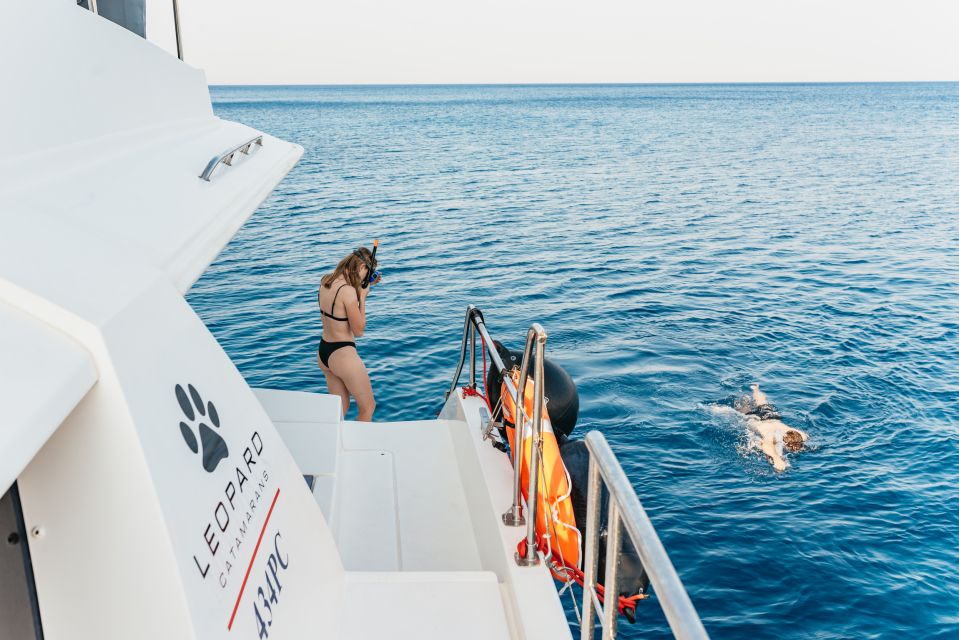 Rhodes: Sunset Catamaran Cruise with Dinner Buffet & Drinks - Practical Tips: What to Bring and How to Enjoy the Water Stop