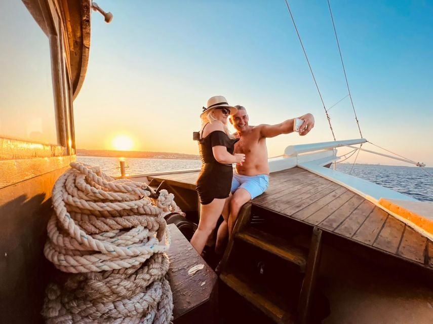 Rhodes: Sunset Cruise with Greek BBQ and Unlimited Drinks - Getting on the Aphrodite Duchess at Mandraki Harbour