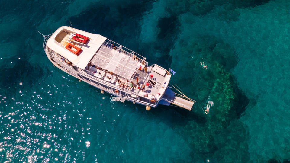 Rhodes: Sunset Cruise with Live Music, Wine & Greek Buffet - Greek buffet and unlimited wine: good food, simple flow