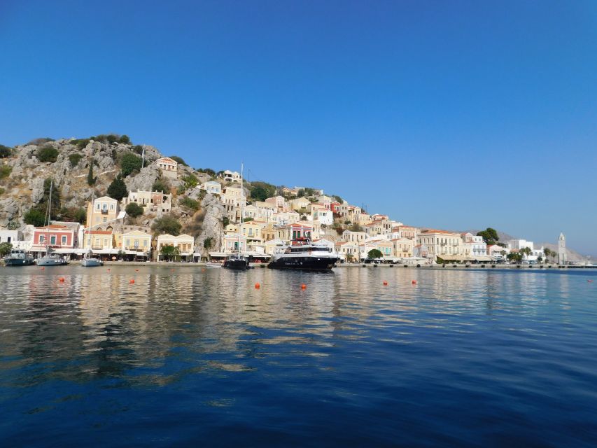 Rhodes Town: Boat Trip to Symi Island and St Marina Bay - Onboard comfort: open deck, AC, toilets, and WiFi