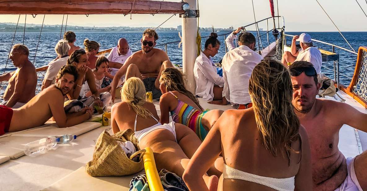 Rhodes Town: Sunset Boat Cruise with Drinks & Snacks - Sailing to Kallithea Springs: music, drinks, and settling in