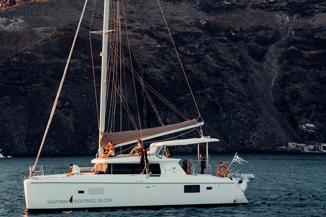 Romantic Sunset Catamaran Caldera Cruise incl. Meal & Drinks - Hotel Pickup and Onboard Vibe: Easy Logistics, Mixed Music Levels