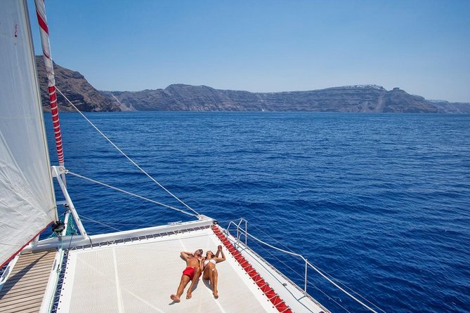 Sailing Catamaran Cruise in Santorini with BBQ, Drinks and Transfer - Hot Springs stop: close to the volcano without the steep hike