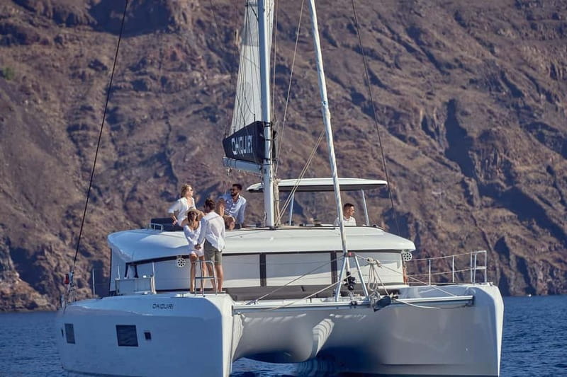 Santorini: Caldera Classic Catamaran Cruise w/ Meal & Drinks - Nea Kameni volcanic waters and the BBQ + drinks setup