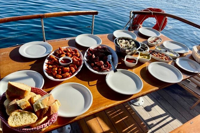 Santorini Caldera Day Traditional Cruise with Meal and Drinks - Red Beach and White Beach: swimming where the colors come from
