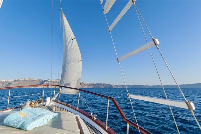 Santorini Caldera Day Traditional Cruise with Meal and Drinks - Passing Akrotiri’s lighthouse: the caldera from a heritage angle