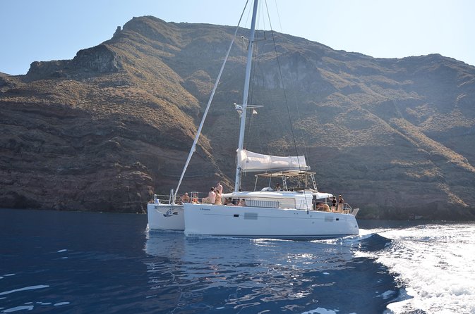 Santorini Caldera Gold Day Cruise with BBQ on board and Open Bar - Entering the Santorini caldera in a 5-hour catamaran
