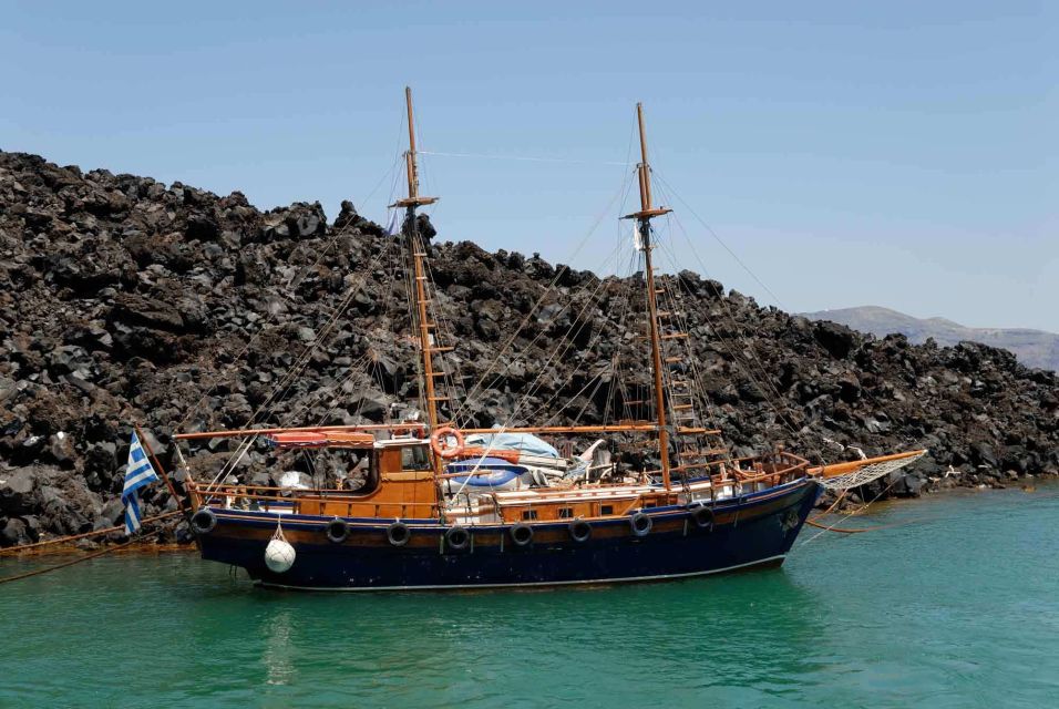 Santorini Caldera: Sunset Cruise with Dinner - Palea Kameni and the thermal springs: swim near the sulfur waters
