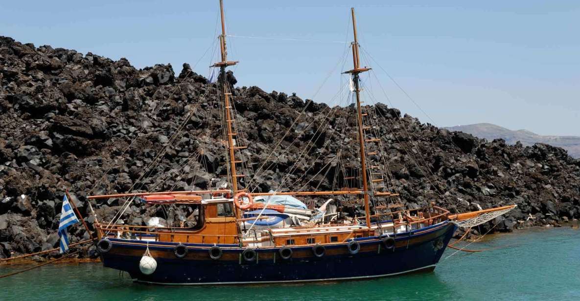 Santorini Caldera: Sunset Cruise with Dinner - The sail back under Oia: where sunset starts to happen early