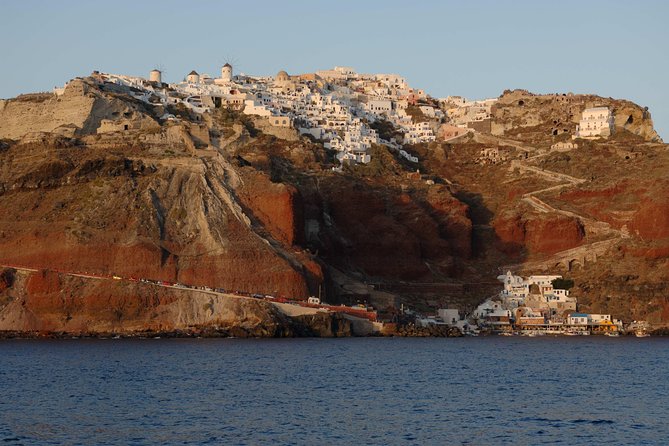 Santorini Caldera Sunset Sailing Cruise with Dinner and Wine - Sunset Near Oia: Watching the Sky Change From the Sea