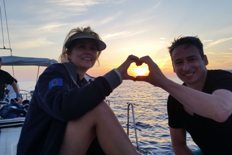 Santorini Caldera: Sunset Sailing Cruise with Meal - Indian Rock, the lighthouse, and sailing into the caldera