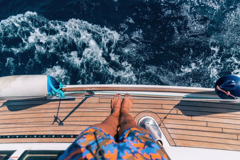Santorini Caldera: Sunset Sailing Cruise with Meal - Fira, Firostefani, and Imerovigli from below the cliffs