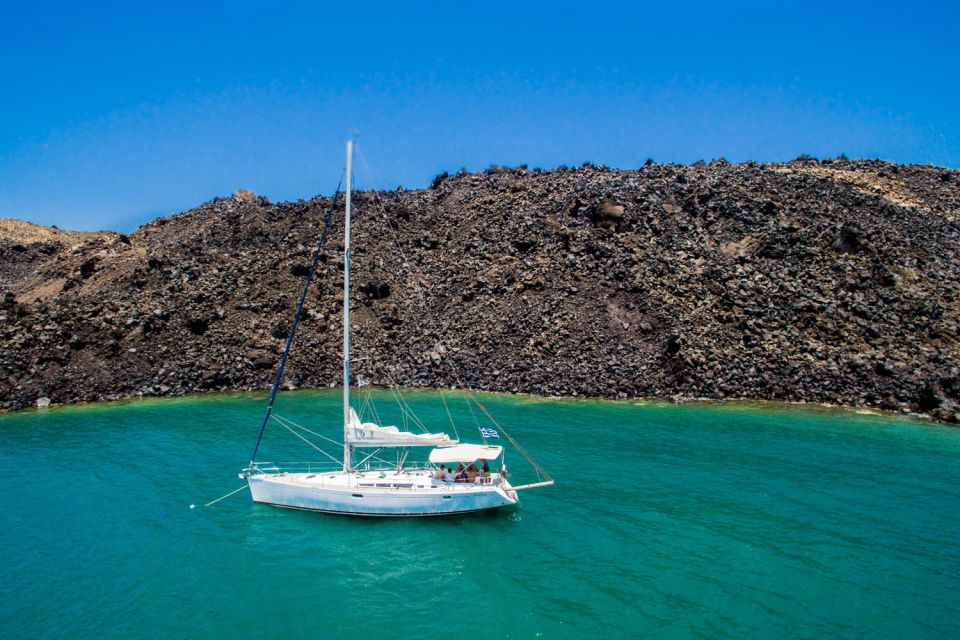 Santorini Caldera: Sunset Sailing Cruise with Meal - Palea Kameni and the volcanic hot-spring area: swim + dinner timing