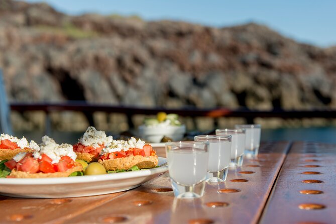 Santorini Caldera Sunset Traditional Cruise with Meal and Drinks - Mesa Pigadia, Black Mountain, and the Rocks That Look Strange in Person