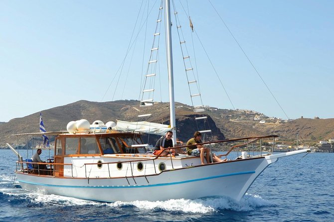 Santorini Caldera Sunset Traditional Cruise with Meal and Drinks - White Beach: The Private-Feel Stop (and the Photo Reward)
