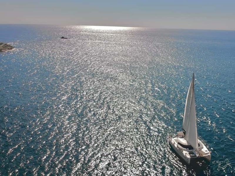 Santorini: Catamaran Cruise with Food and Drinks - Sailing Past the Lighthouse and Indian Rocks