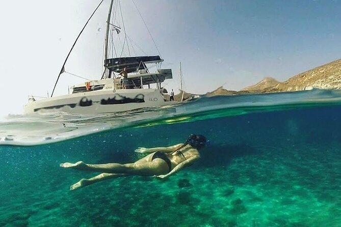 Santorini Catamaran Cruise with Fresh Meal and Open Bar - Palea Kameni hot springs: the swim stop that actually changes the day