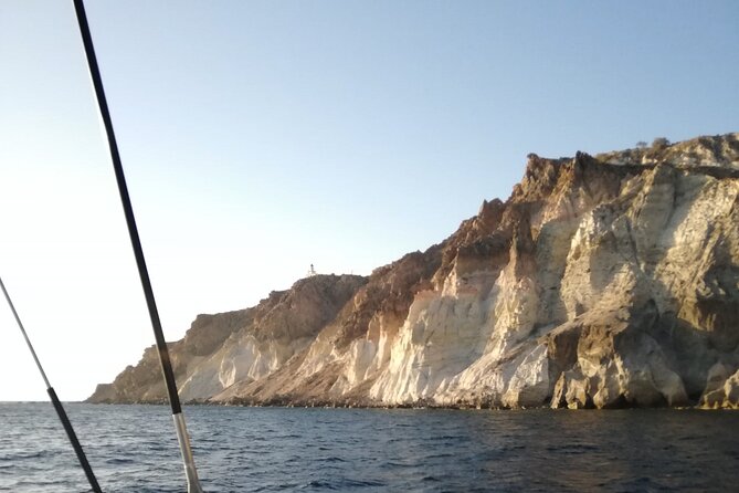 Santorini Catamaran Cruise with Fresh Meal and Open Bar - Open bar vibe: local wine, local beer, and no driving worries