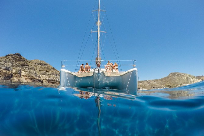 Santorini Catamaran Cruise with Fresh Meal and Open Bar - Red Beach and White Beach: the two stops that make the water feel unreal