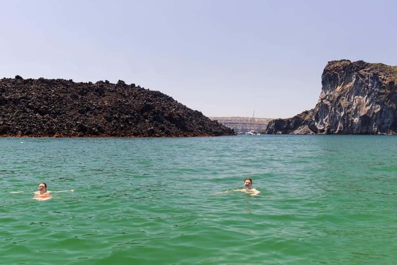 Santorini: Catamaran Cruise with Fresh Meal & Open Bar - Black Mountain coves and snorkel time with provided gear
