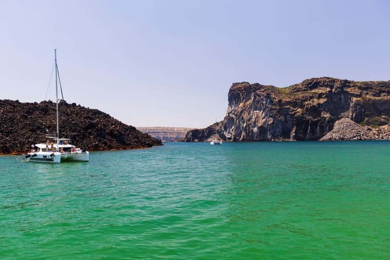 Santorini: Catamaran Cruise with Fresh Meal & Open Bar - Hot springs and sulphuric coves: the volcanic stop you’ll remember