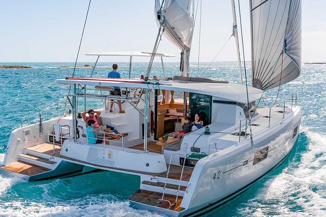 Santorini Catamaran Cruise with Greek Meal, Open-Bar and Sunset - From Your Santorini Hotel to the Catamaran Deck