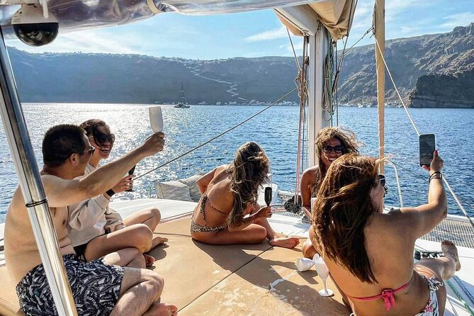 Santorini Catamaran Cruise: with Lunch, BBQ, Open Bar, Transfers - Transfers, group size, and how the day stays friendly