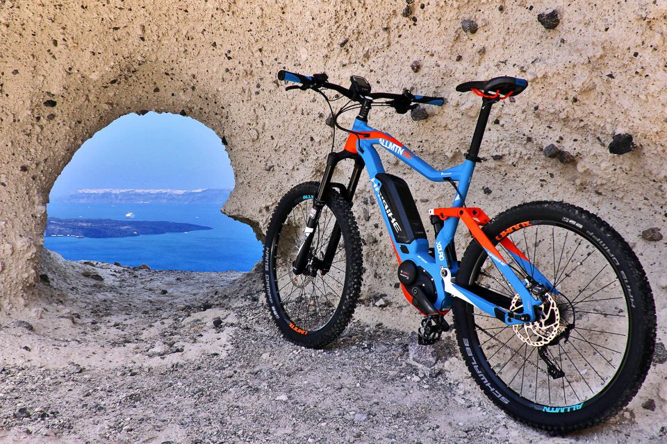 Santorini: Electric Mountain Bike Adventure - Emporeio maze village: orange juice, medieval castle vibes