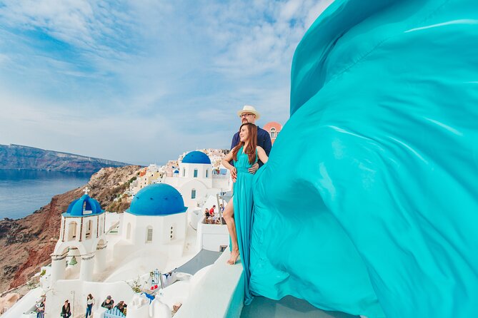 Santorini flying dress photo - Oia Village: the classic backdrop for flying dress photos